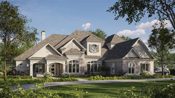 a front view of a house with a big yard and potted plants