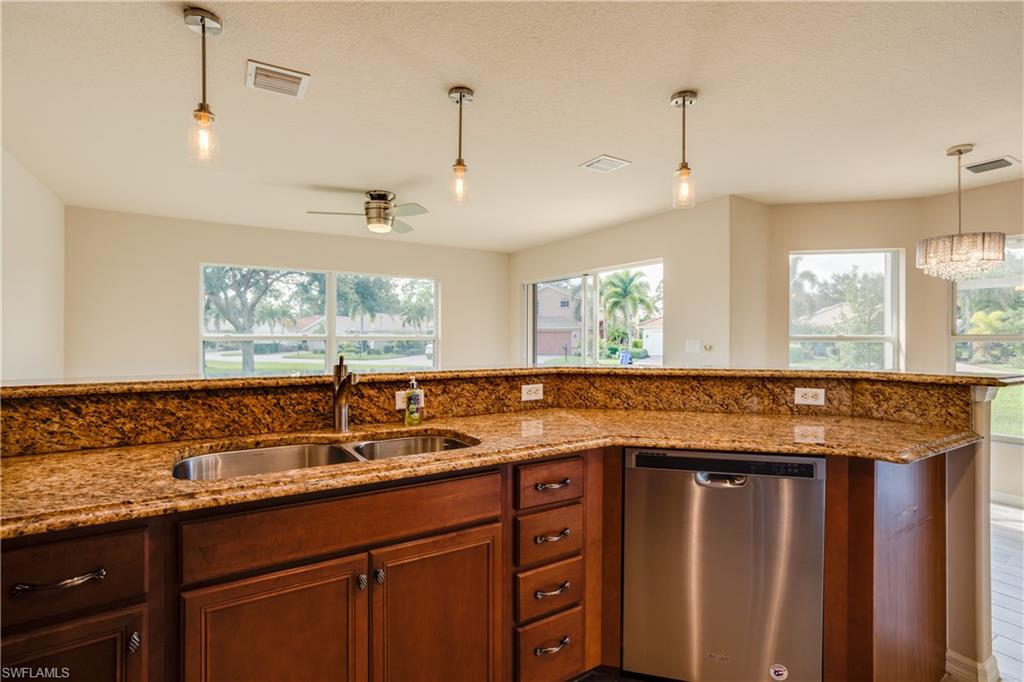 9026 Astonia Way Estero, FL 33967 - Photo 14 of 38 a kitchen with a sink and a window