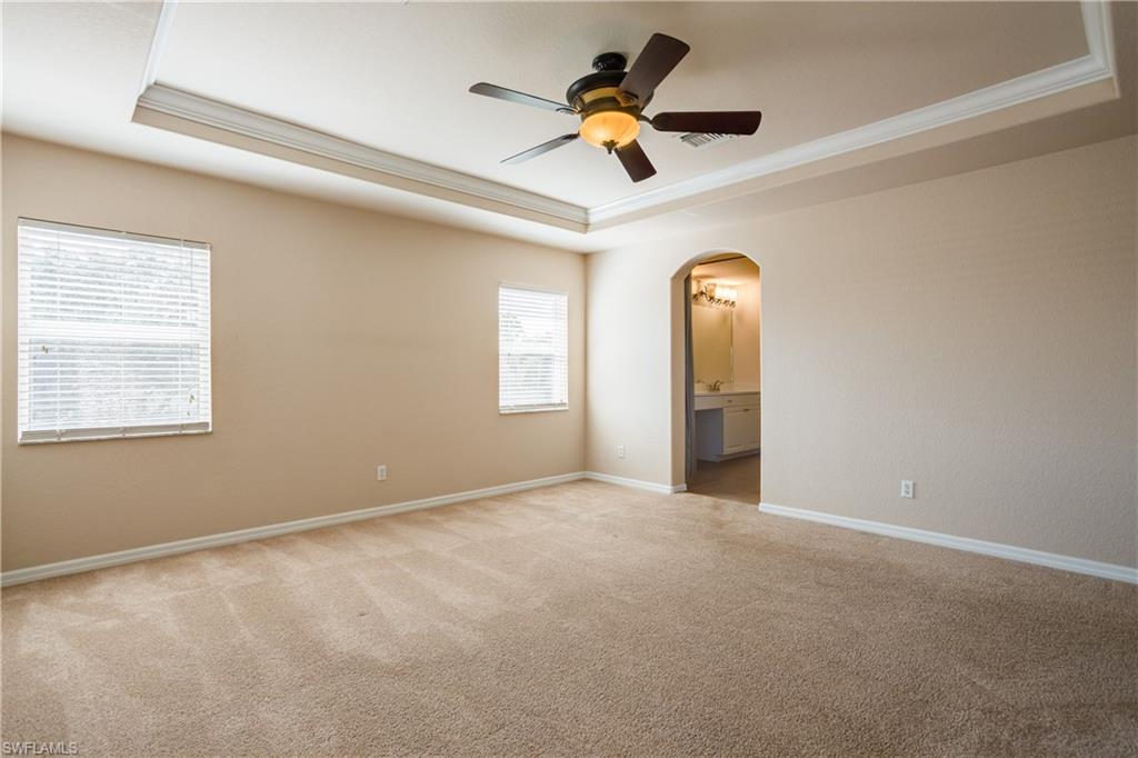 9026 Astonia Way Estero, FL 33967 - Photo 18 of 38 a view of a room with a ceiling fan and window