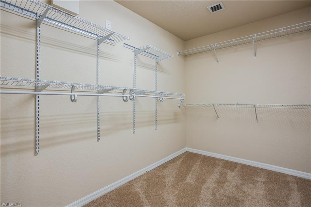 9026 Astonia Way Estero, FL 33967 - Photo 21 of 38 a view of a room with racks on the wall