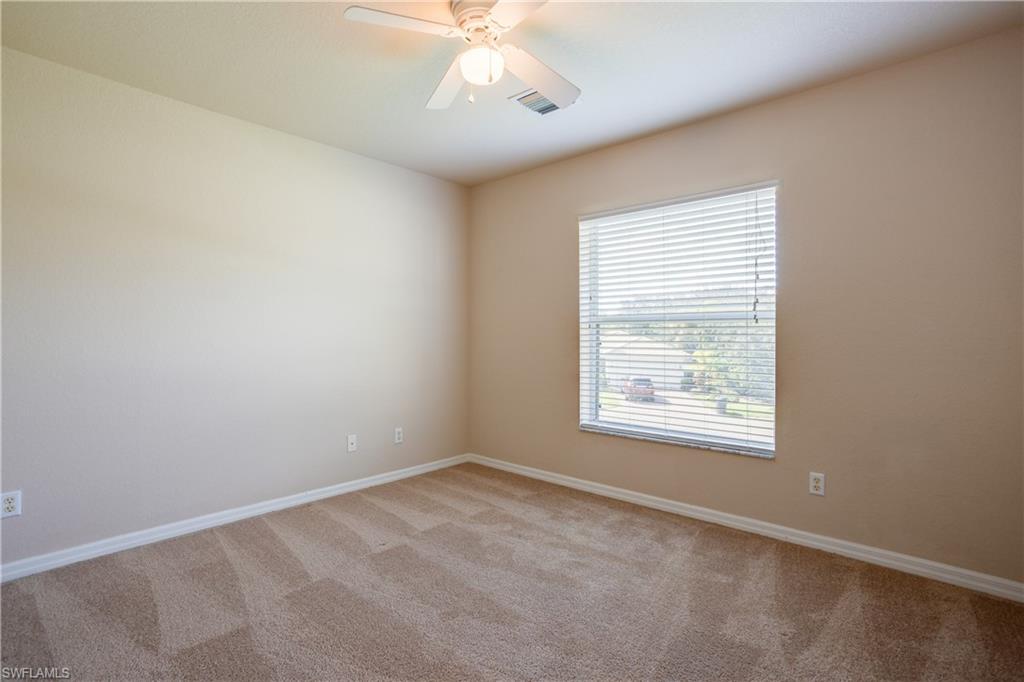 9026 Astonia Way Estero, FL 33967 - Photo 22 of 38 an empty room with a window