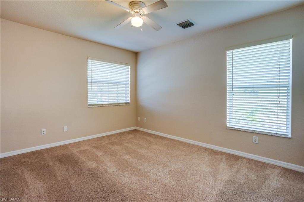 9026 Astonia Way Estero, FL 33967 - Photo 27 of 38 a view of an empty room with a window