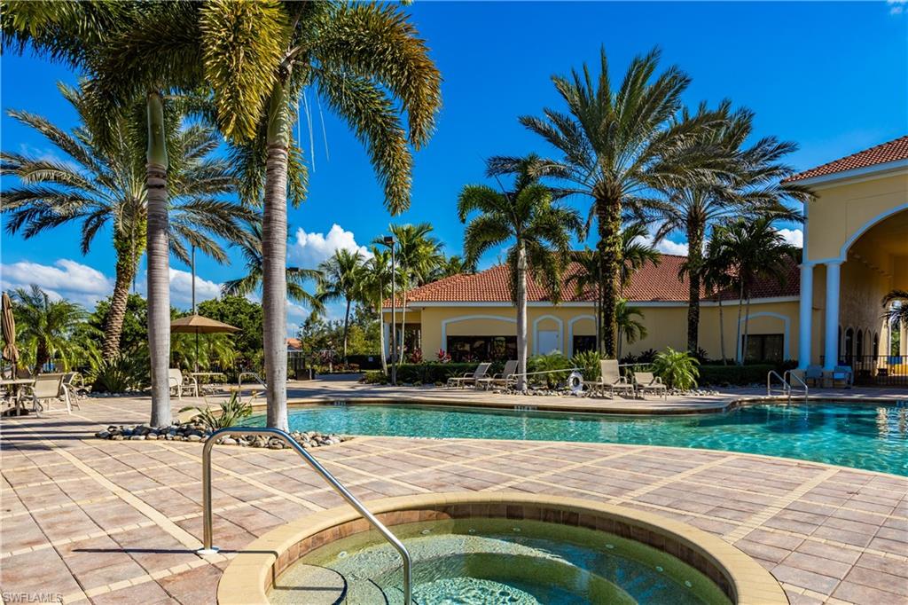 9026 Astonia Way Estero, FL 33967 - Photo 31 of 38 a house with palm tree in front of it