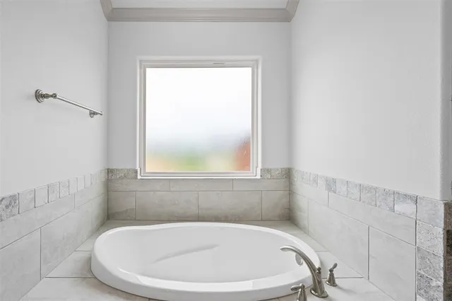 a white bath tub sitting in a bathroom
