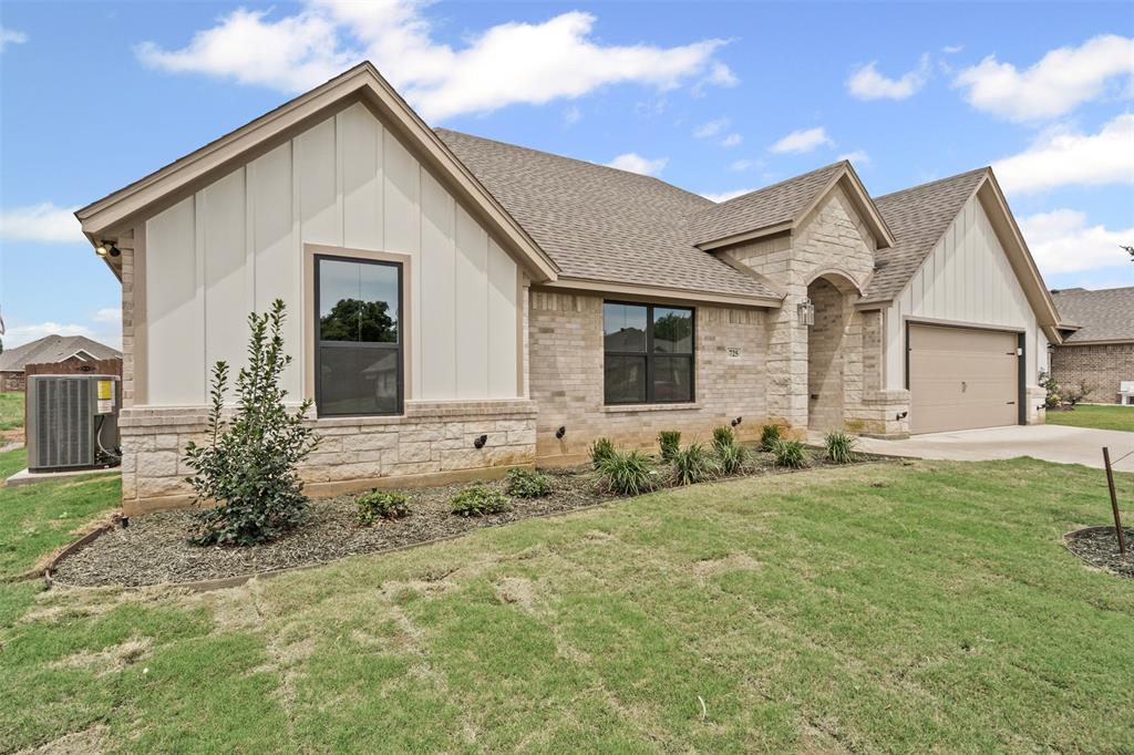 725 Jameson Springtown, TX 76082 - Photo 2 of 38 a view of a house with backyard and garden