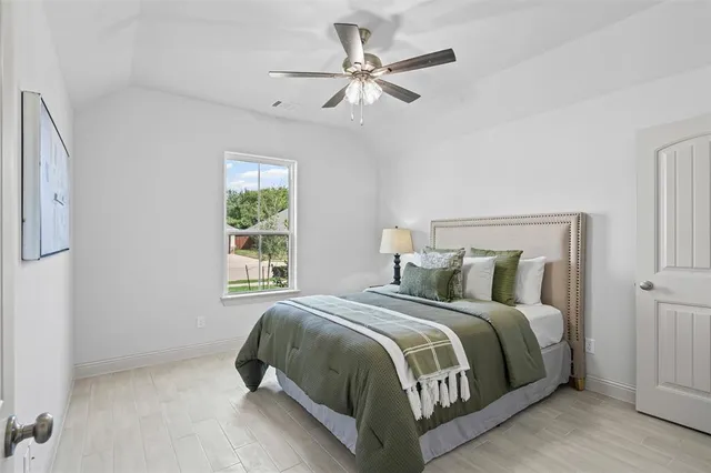 a bedroom with a bed and window