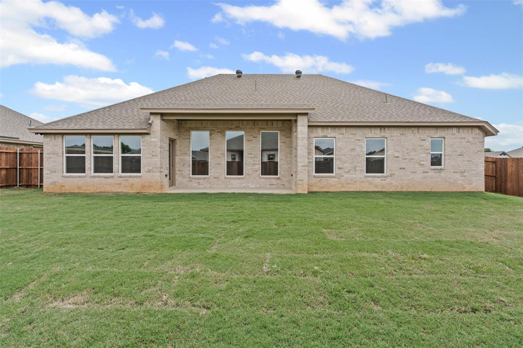 725 Jameson Springtown, TX 76082 - Photo 30 of 38 a view of a house with a garden