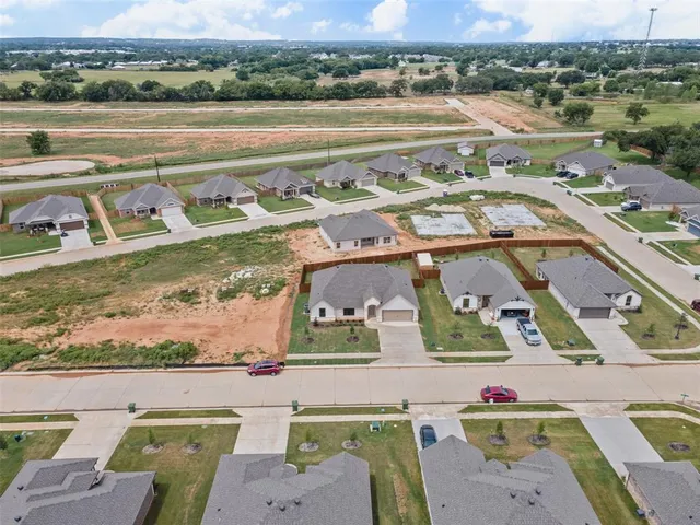 an aerial view of a city with lots of residential buildings