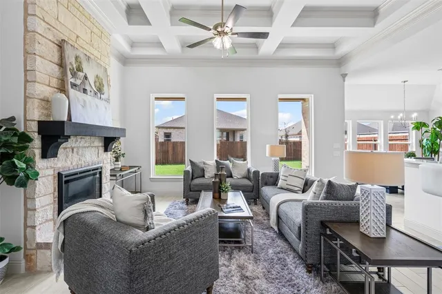 a living room with fireplace furniture and a fireplace