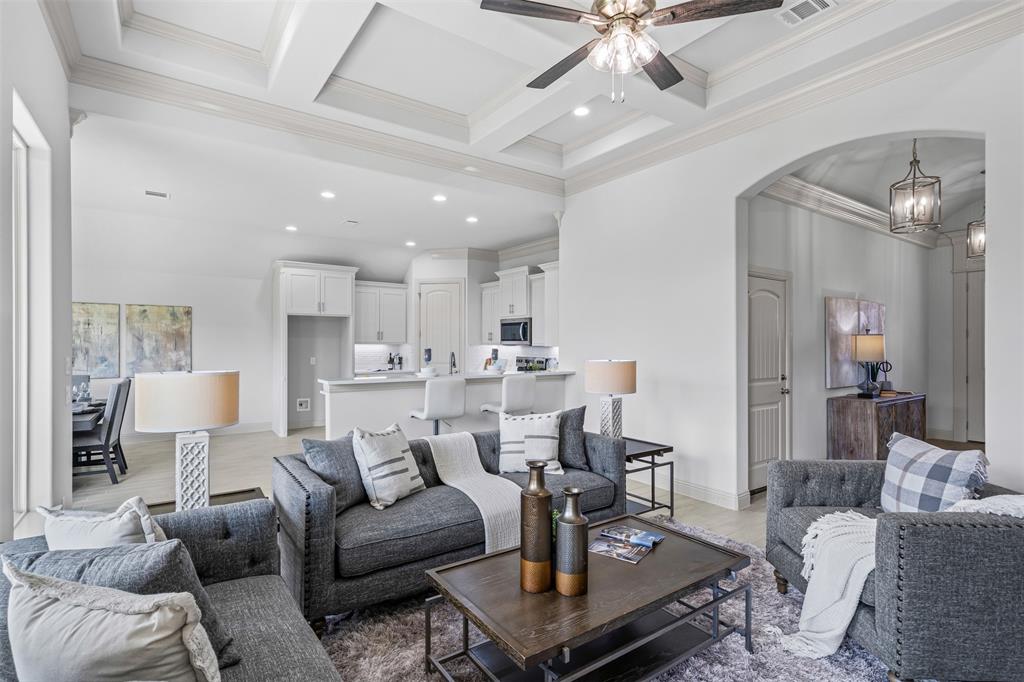 725 Jameson Springtown, TX 76082 - Photo 8 of 38 a living room with furniture and a chandelier