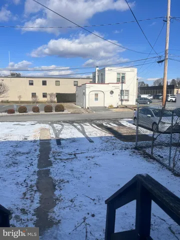 a view of a terrace with wooden walls