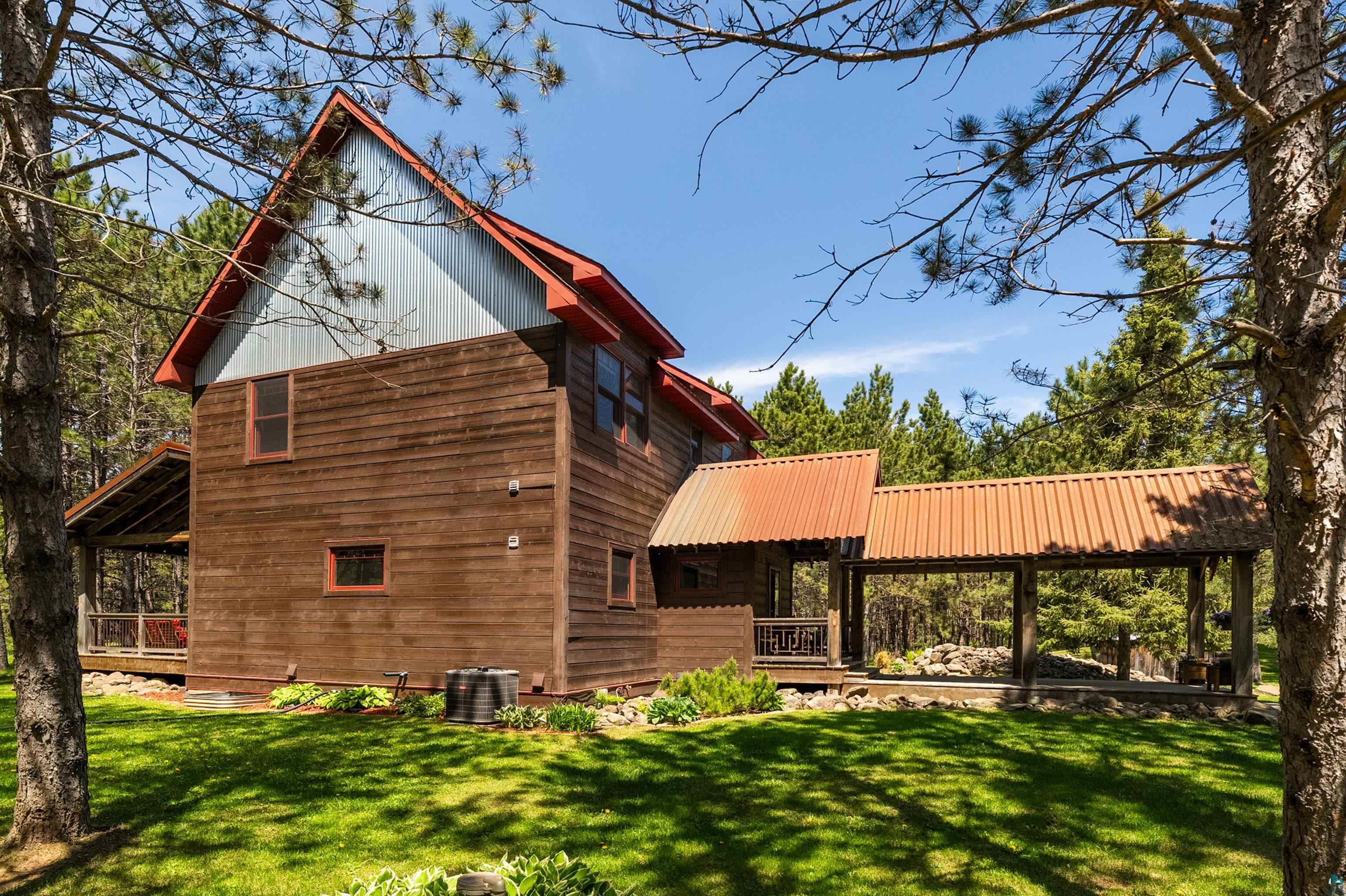 75 East Stark Road Esko, MN 55733 - Photo 54 of 87 Wood-sided exterior featuring a gabled roofline with metal accents