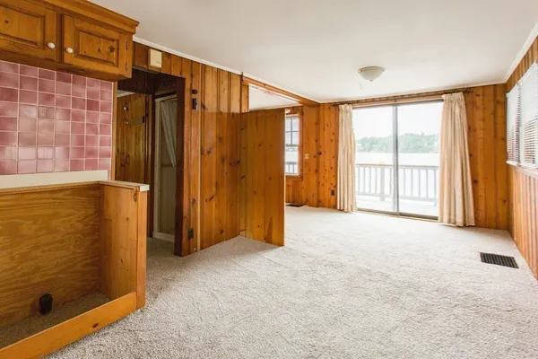 a balcony with wooden floor and city view