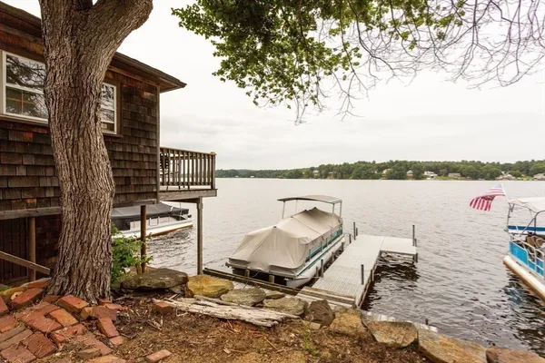 a house with river in front of it
