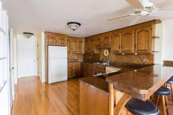 a kitchen with stainless steel appliances granite countertop a stove and a sink