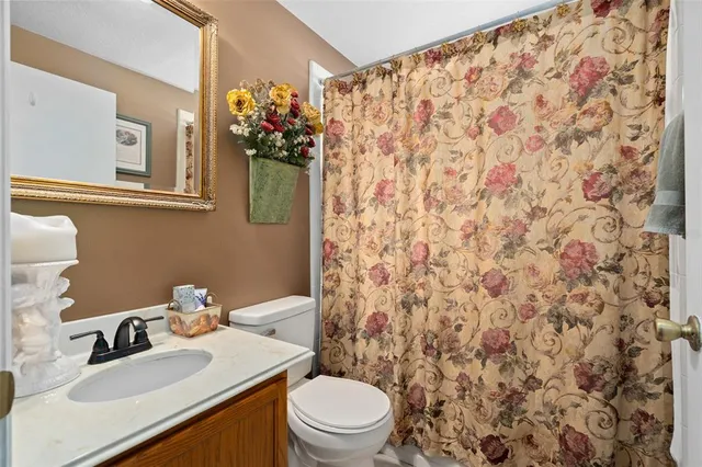 a bedroom with a bed and a book shelf