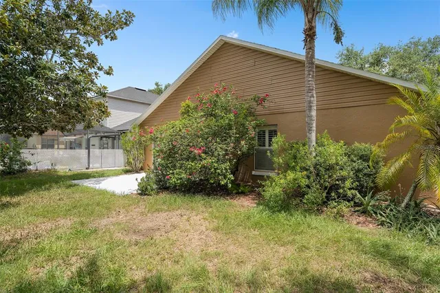 an aerial view of a house with outdoor space and lake view