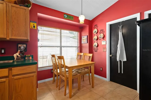 a dining room with furniture and window