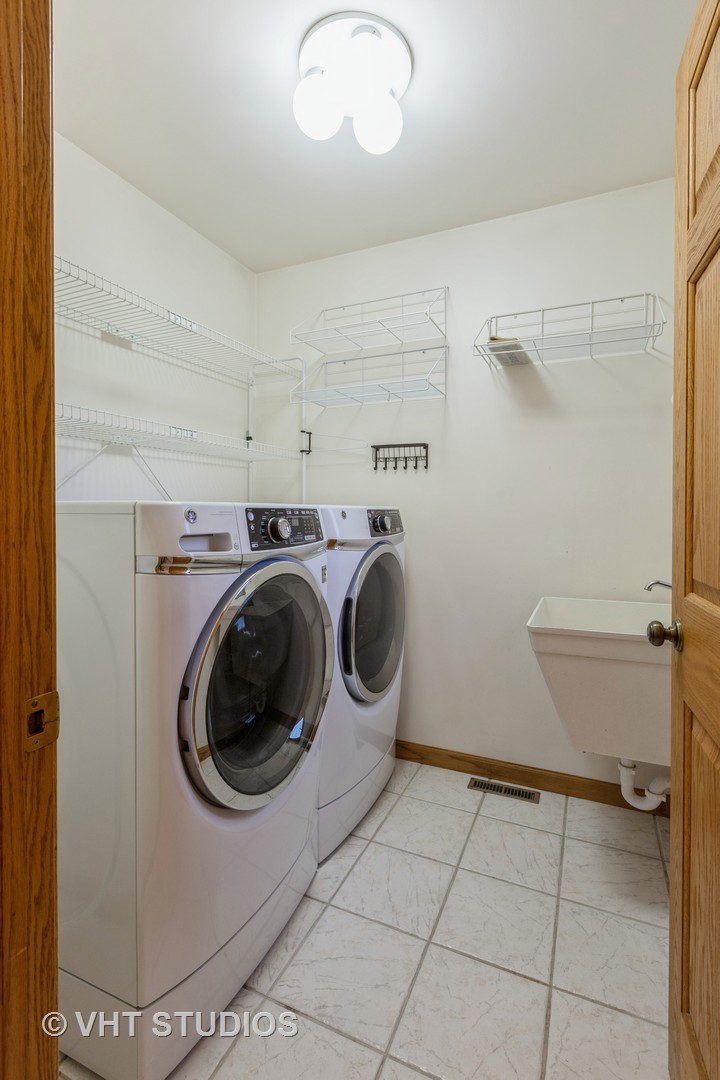 3440 Hermann Road Lee, IL 60530 - Photo 18 of 37 a utility room with dryer and washer
