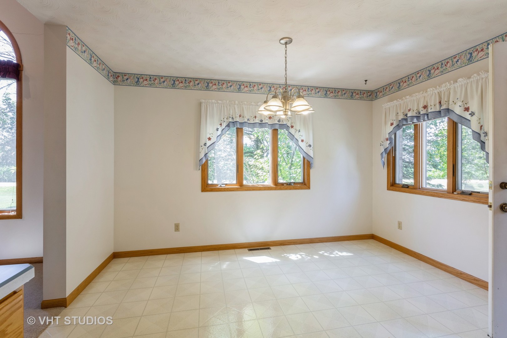3440 Hermann Road Lee, IL 60530 - Photo 6 of 37 a view of an empty room with window and chandelier fan