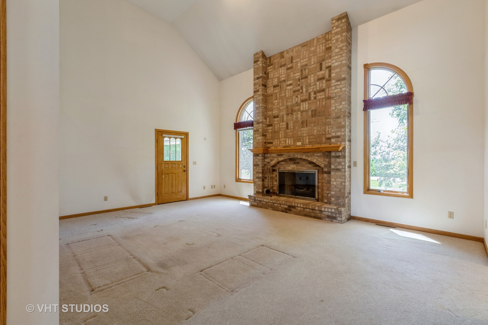 3440 Hermann Road Lee, IL 60530 - Photo 7 of 37 an empty room with windows and fireplace