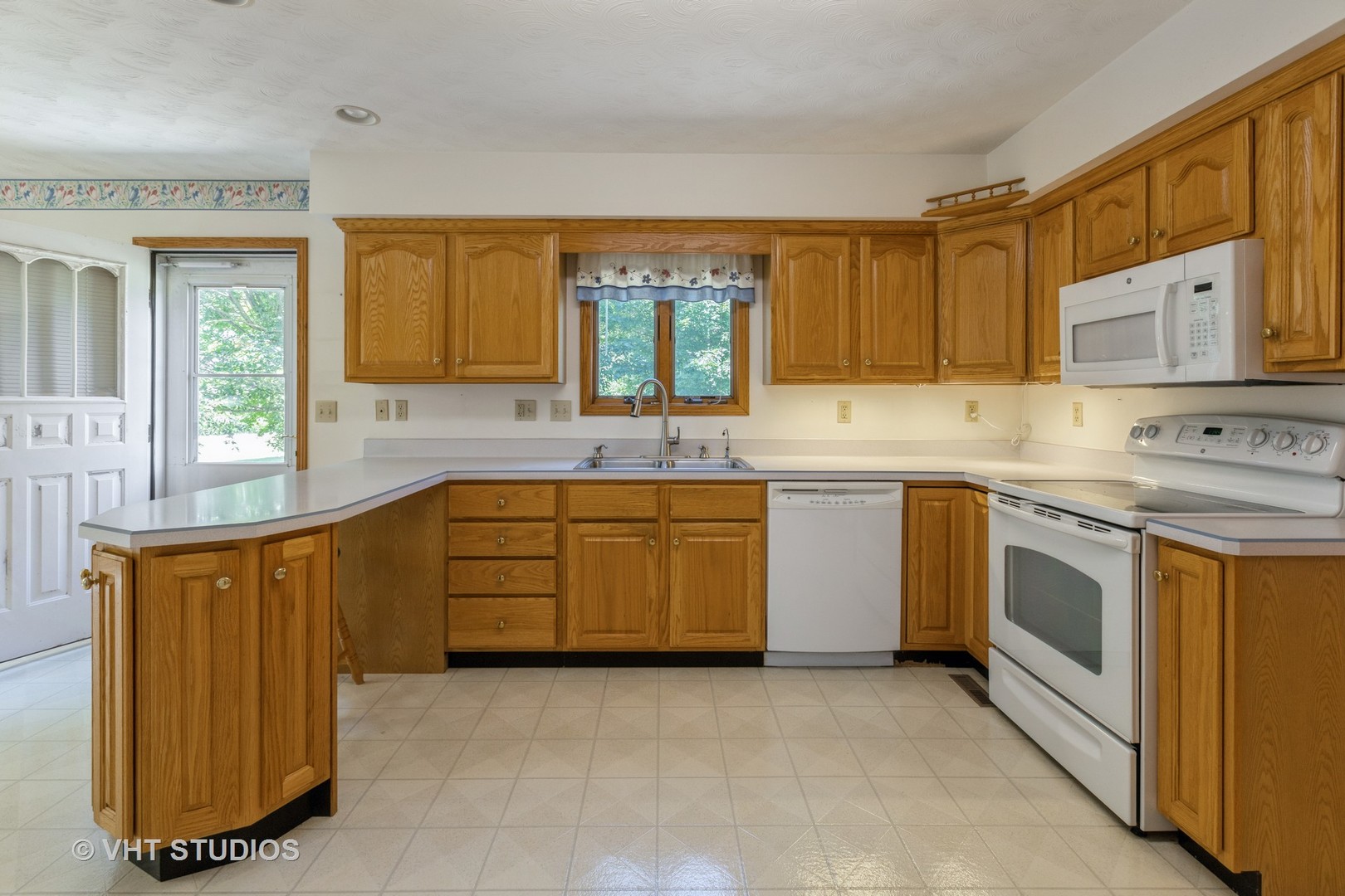 3440 Hermann Road Lee, IL 60530 - Photo 8 of 37 a kitchen with stainless steel appliances granite countertop a stove a sink and a microwave