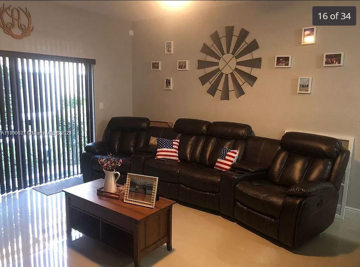 4913 Southwest 141st Avenue, Unit 2 Miramar, FL 33027 - Photo 5 of 12 a living room with furniture