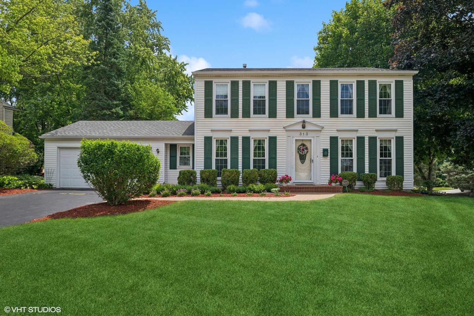 313 Ambleside Drive Roselle, IL 60172 - Photo 1 of 46 front view of a house with a yard