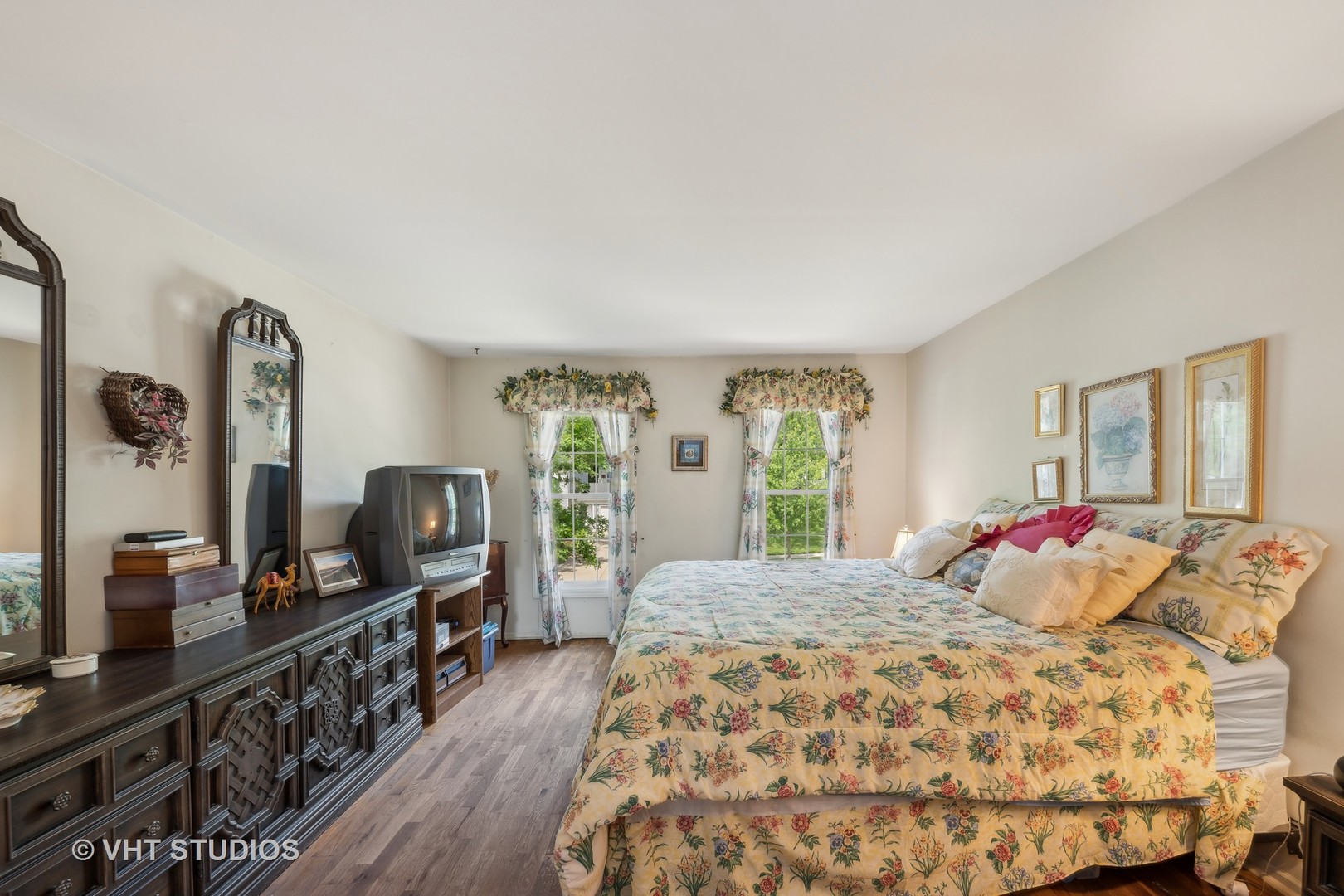 313 Ambleside Drive Roselle, IL 60172 - Photo 21 of 46 a bedroom with a large bed and wooden floor