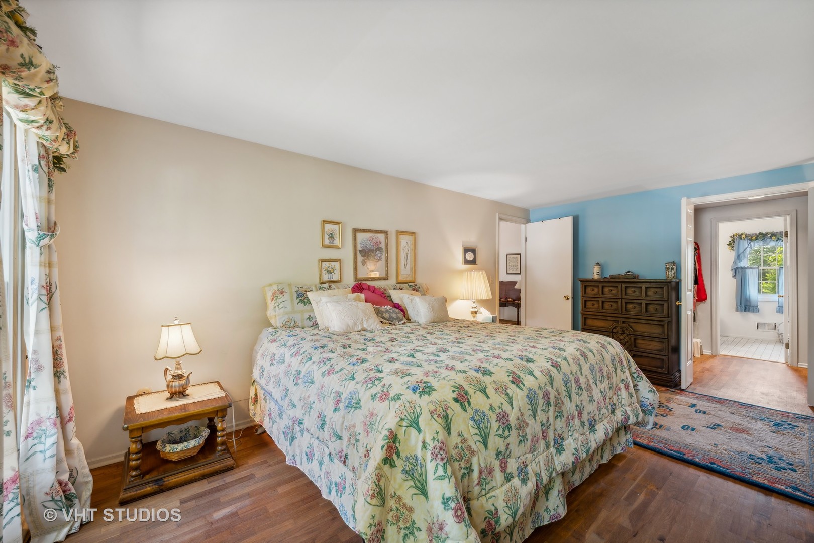 313 Ambleside Drive Roselle, IL 60172 - Photo 22 of 46 a bedroom with a bed and dresser with mirror