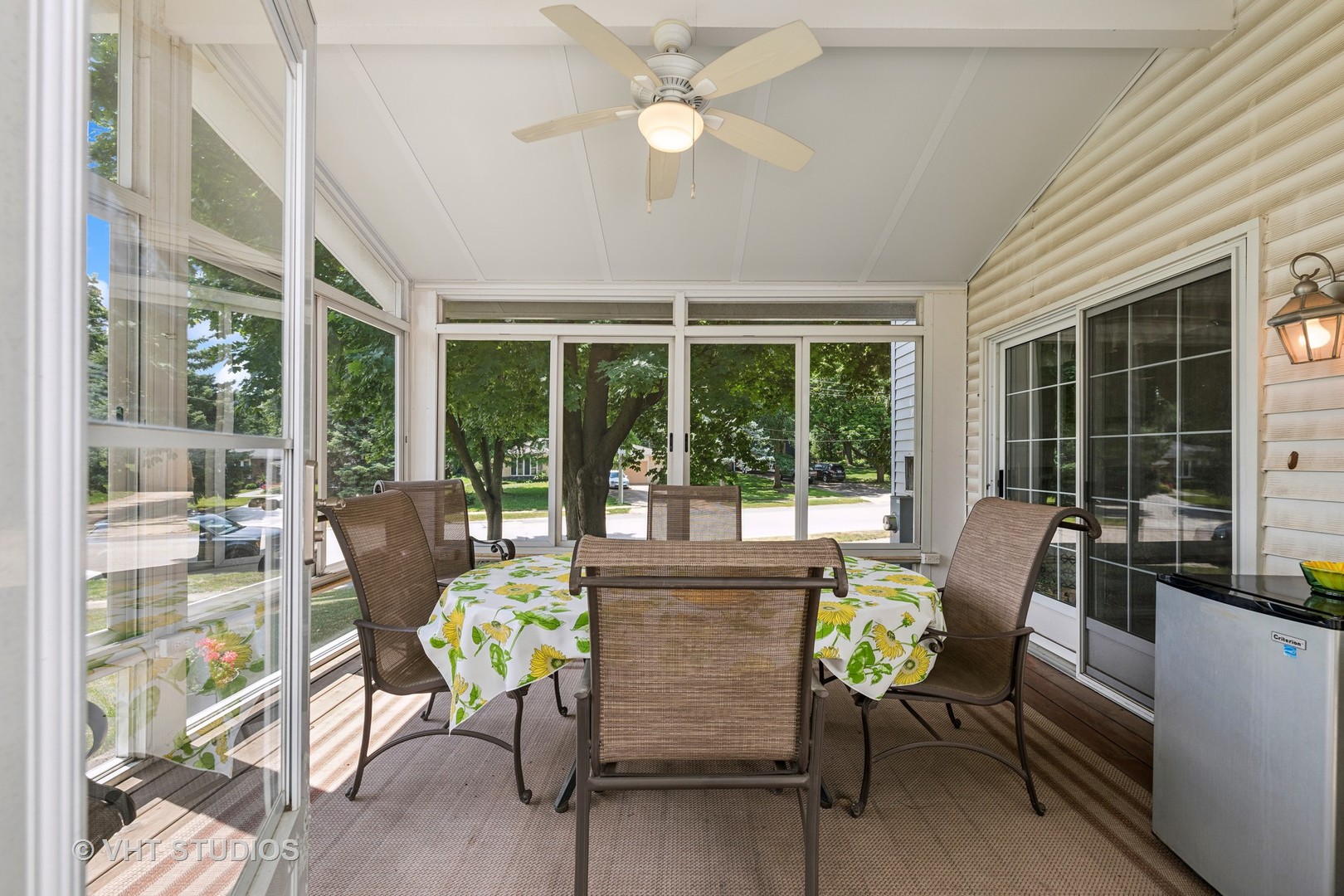 313 Ambleside Drive Roselle, IL 60172 - Photo 26 of 46 a view of a dining room with furniture large windows and wooden floor
