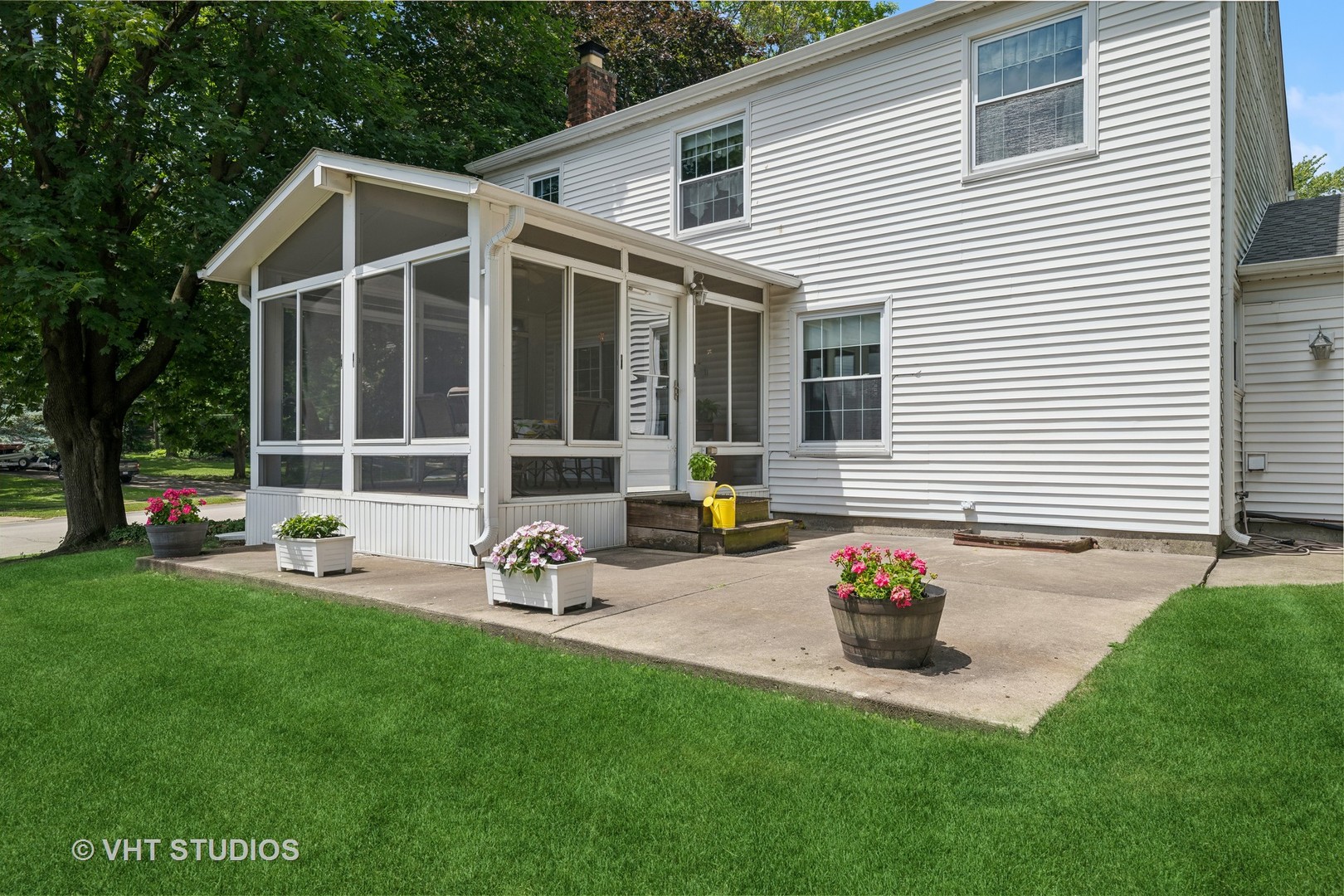 313 Ambleside Drive Roselle, IL 60172 - Photo 29 of 46 a front view of a house with patio and yard