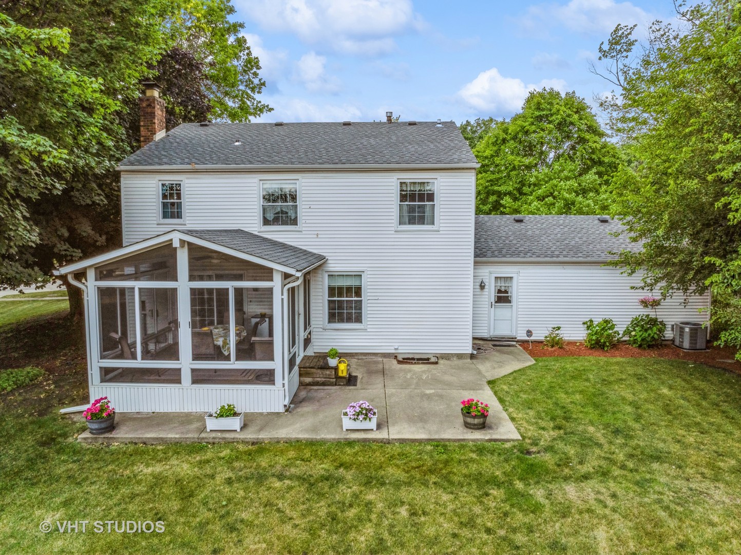 313 Ambleside Drive Roselle, IL 60172 - Photo 34 of 46 a view of a house with a yard and a large tree