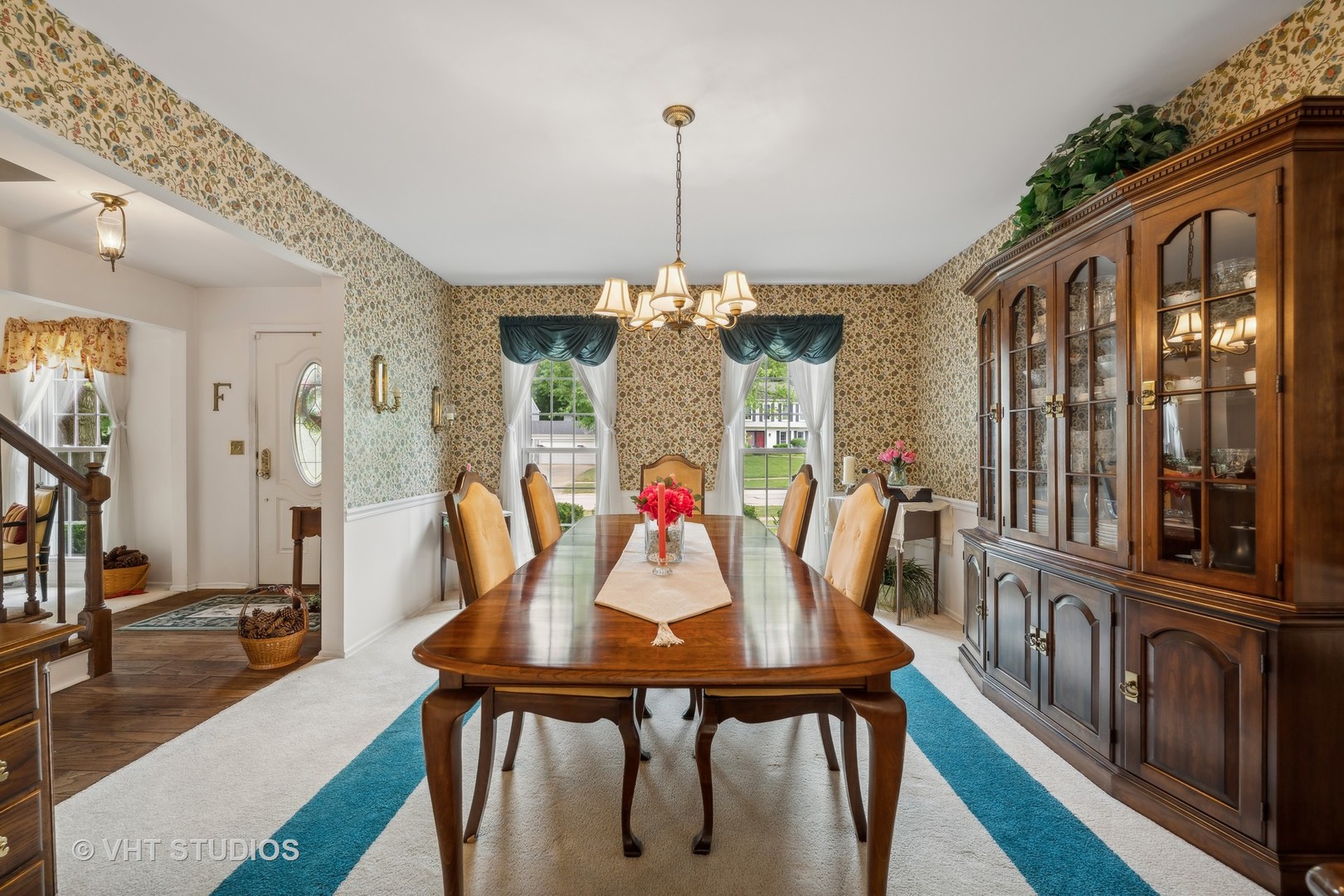 313 Ambleside Drive Roselle, IL 60172 - Photo 7 of 46 a view of a dining room with furniture window and wooden floor