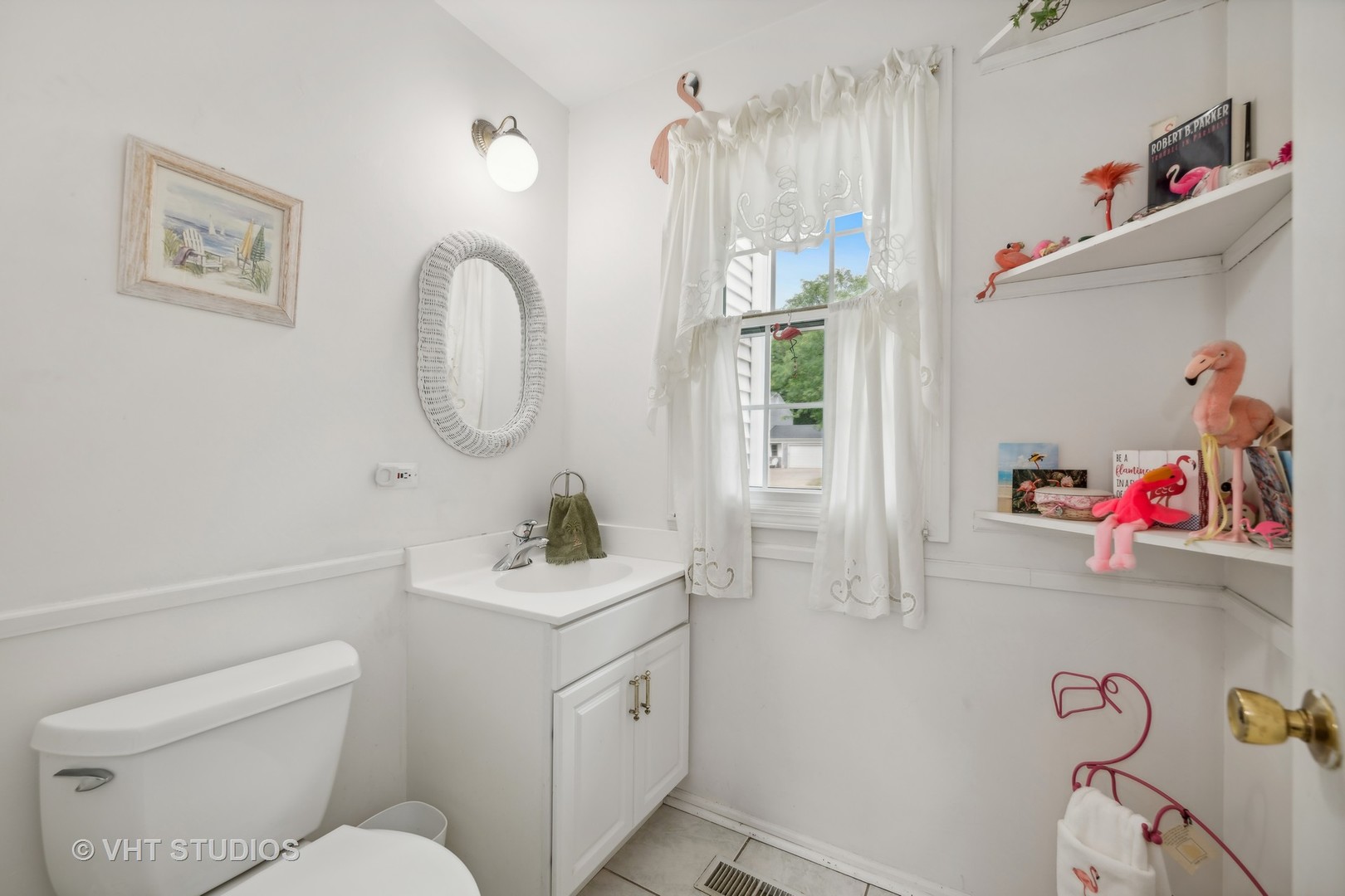 313 Ambleside Drive Roselle, IL 60172 - Photo 9 of 46 a bathroom with a sink a toilet and a mirror