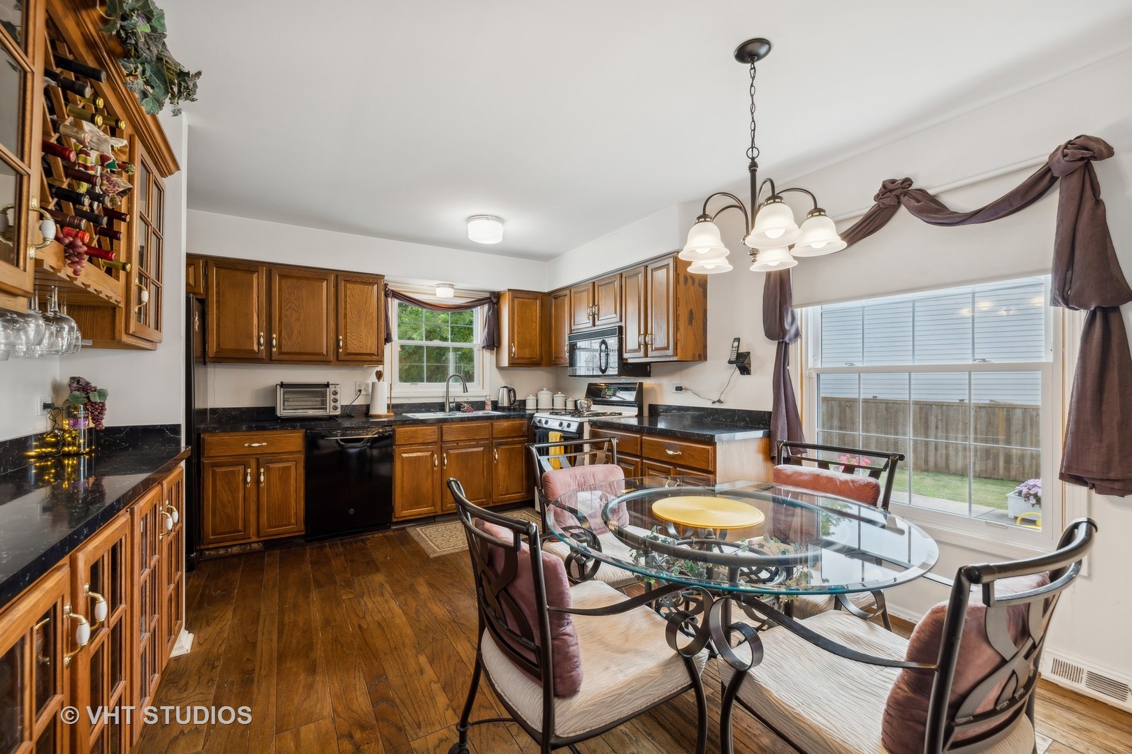 313 Ambleside Drive Roselle, IL 60172 - Photo 10 of 46 a view of a dining room with furniture window and wooden floor