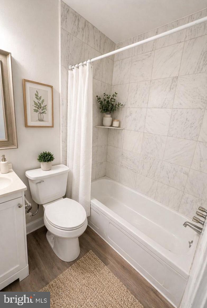 5608-00 Ridge Avenue, Unit R3 Philadelphia, PA 19128 - Photo 6 of 6 a bathroom with a sink toilet and a bathtub
