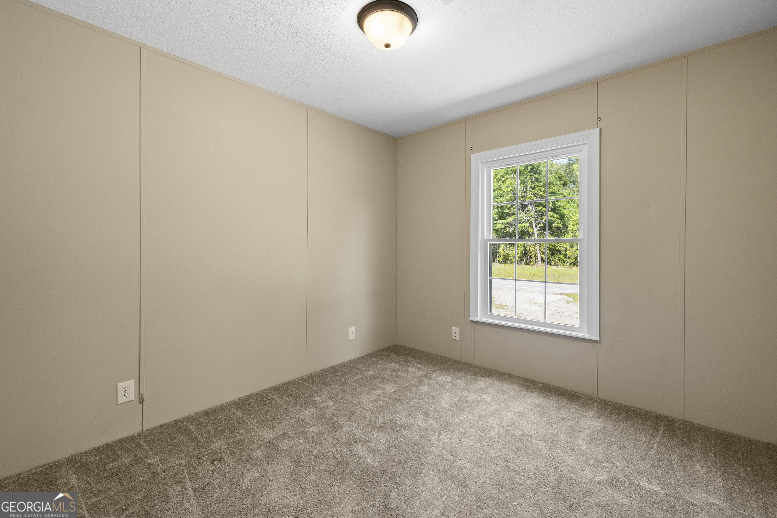1173 Highway 21 Springfield, GA 31329 - Photo 13 of 18 an empty room with windows and closet