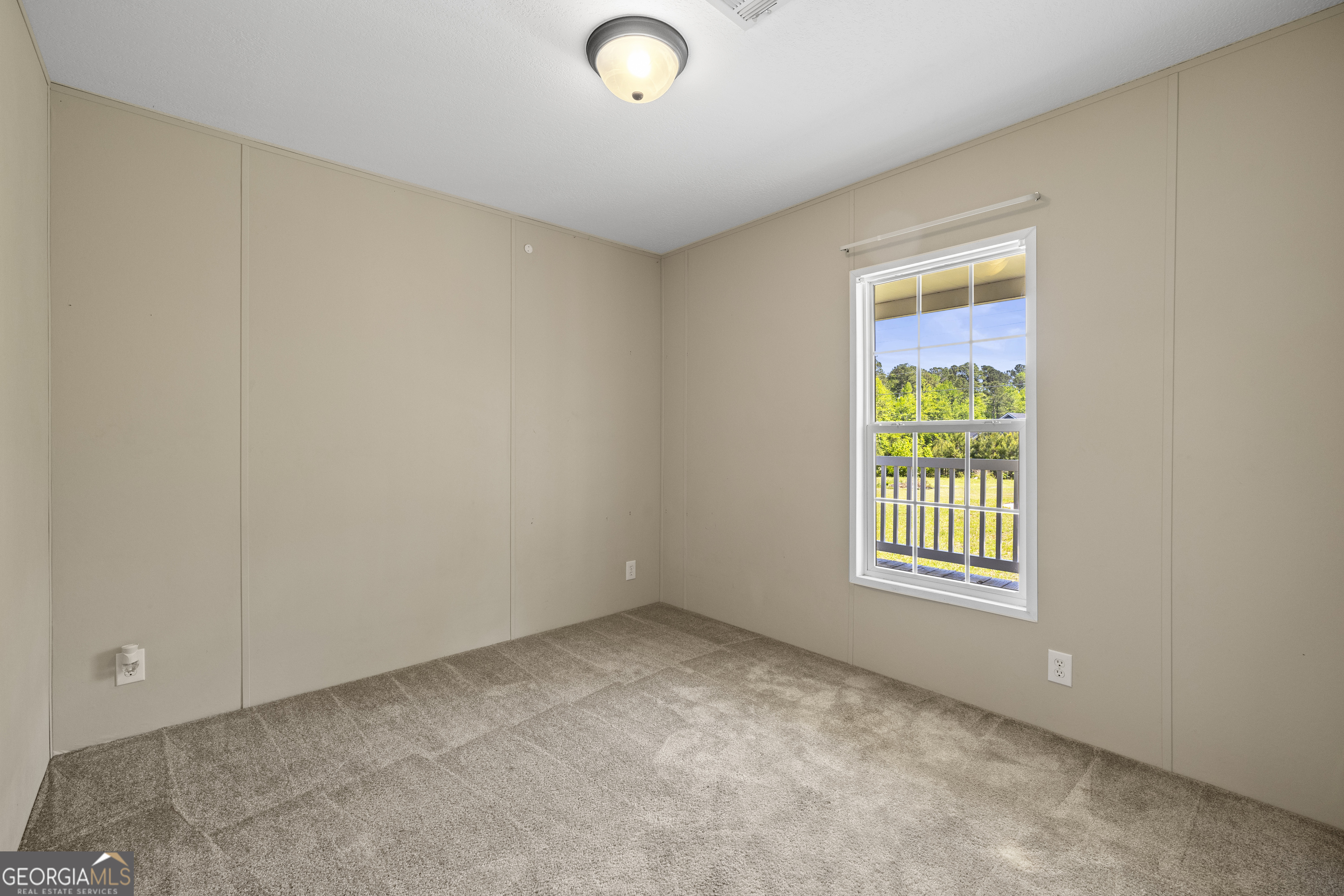 1173 Highway 21 Springfield, GA 31329 - Photo 14 of 18 an empty room with a window