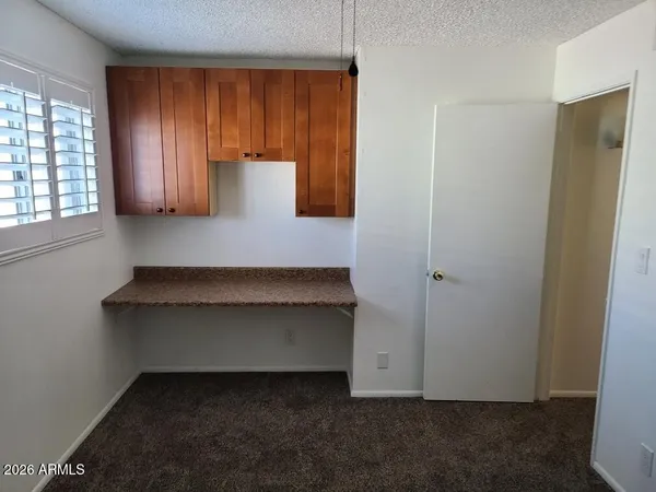 an empty room with a mirror