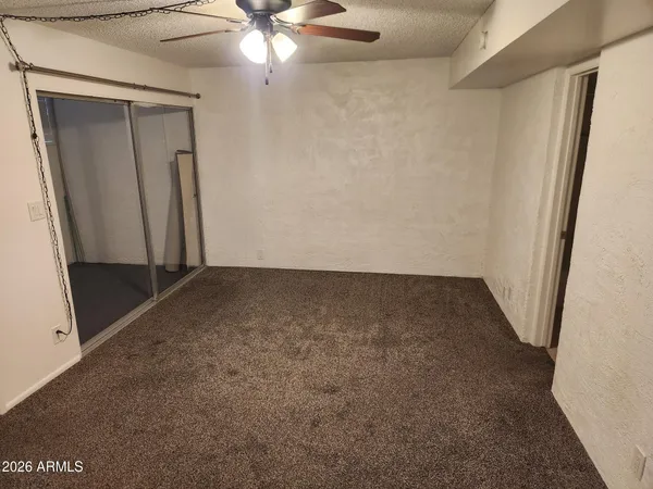 a view of a house with a fence