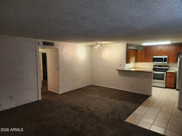 a view of a kitchen with a sink