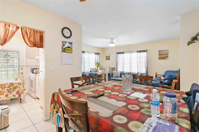 a view of a dining room with furniture and a window