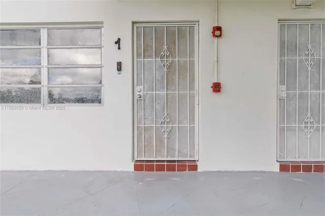 a view of a door and a window