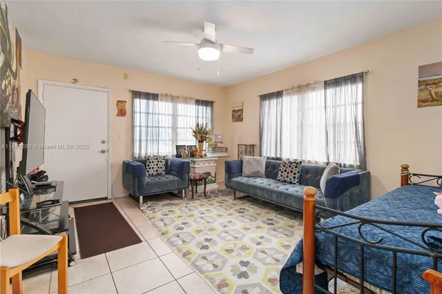 a living room with furniture and a window