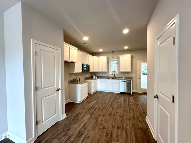 a view of kitchen with wooden floor