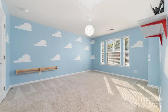 a view of an empty room with windows