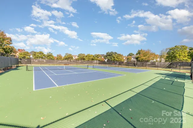 a view of an outdoor space and tennis court