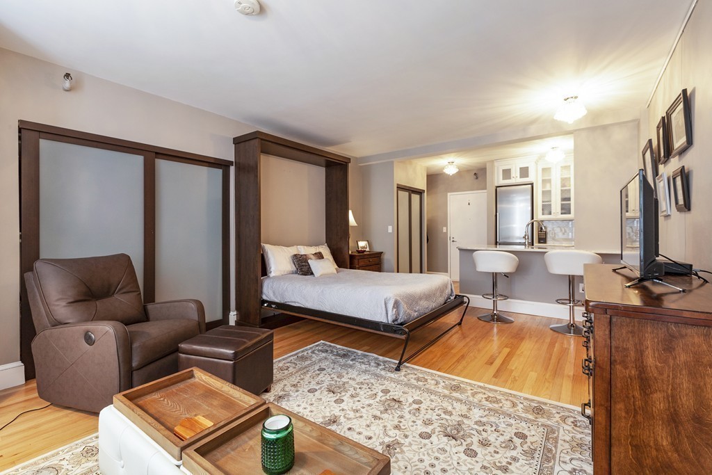 42 8th Street, Unit 4106 Boston, MA 02129 - Photo 5 of 17 a living room with furniture and a couch