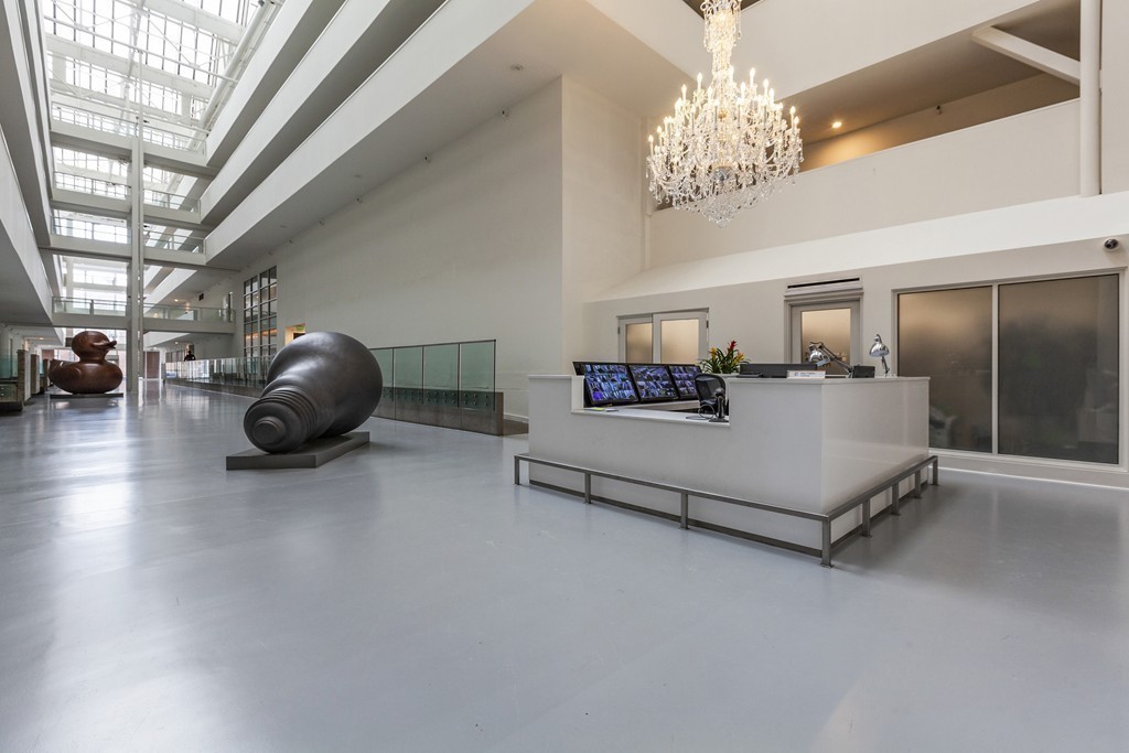 42 8th Street, Unit 4106 Boston, MA 02129 - Photo 9 of 17 a spacious bedroom with a bed and chandelier